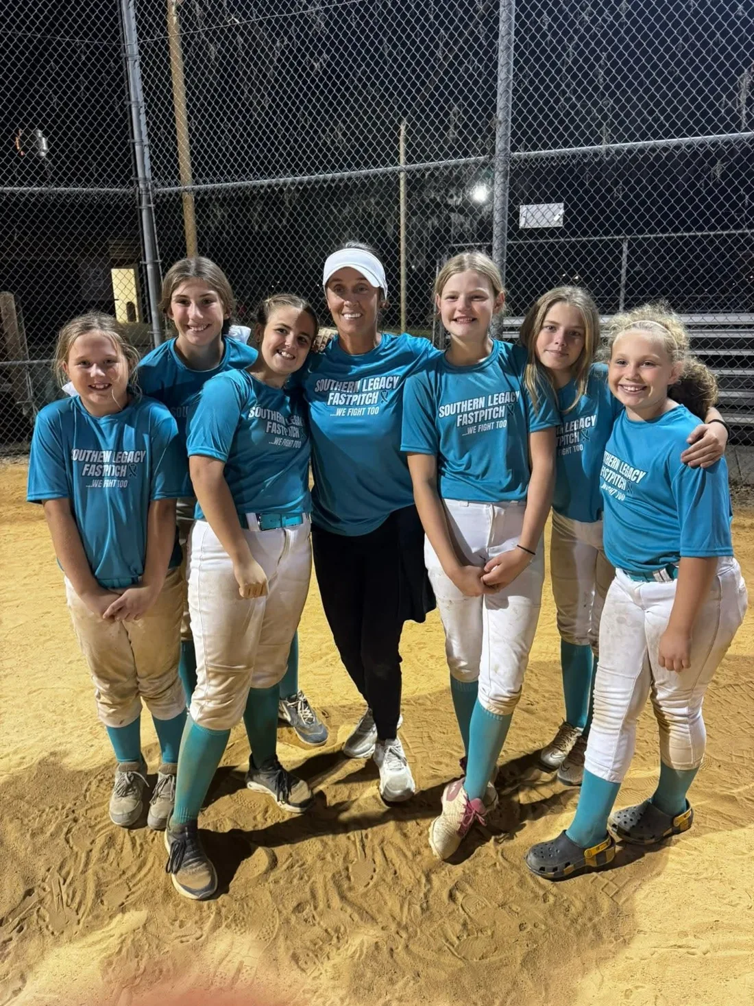 Coach Casey and young pitchers together at the field